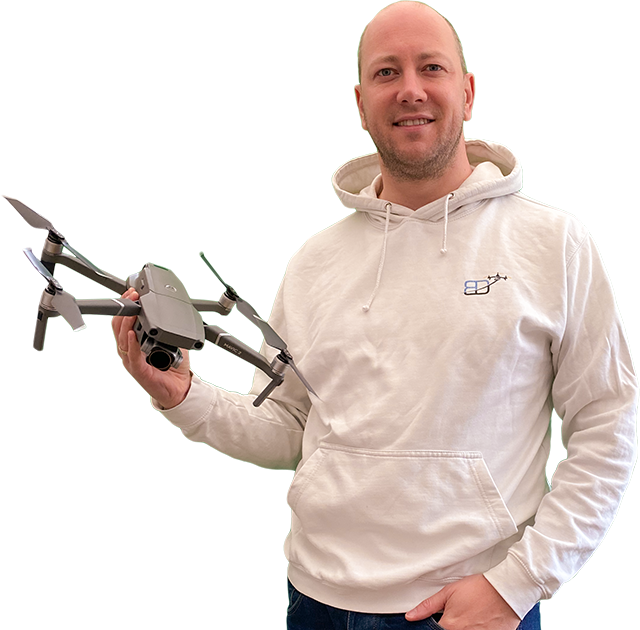 body shot photo of Philippe Francken wearing a Bristol Drones hoody and holding a "DJI" "Mavic 2 Pro" drone