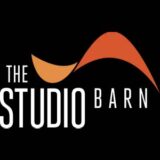 "The Studio Barn" on a black background.